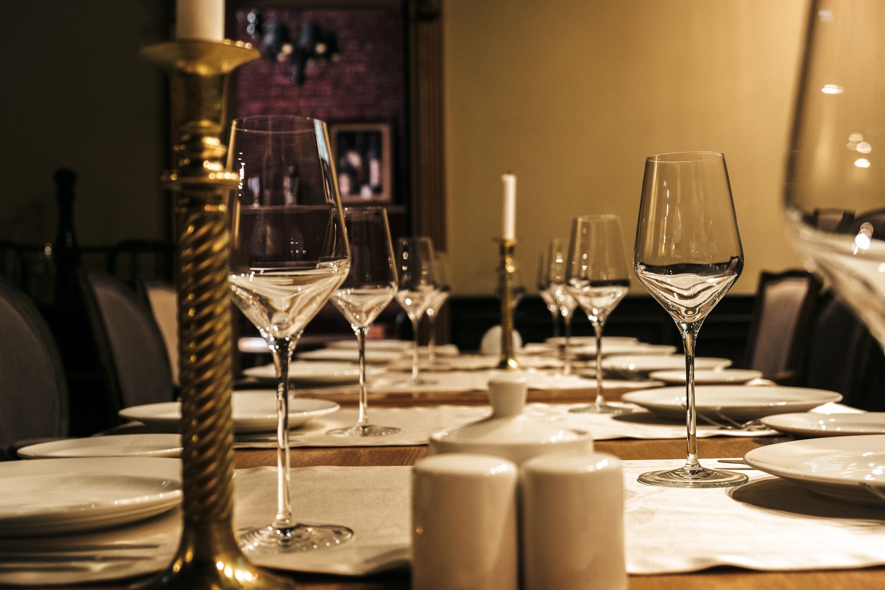 Luxurious dining table with wine glasses and candle holders